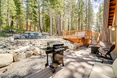 a bbq on a deck in the woods at Near Ski Resorts and Trails Truckee Home with Hot Tub in Truckee