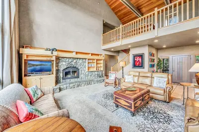 a living room with a couch and a fireplace at South Tahoe Haven Views Comfort Fun in South Lake Tahoe