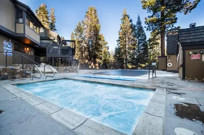 a swimming pool in the backyard of a house at Mammoth Basecamp Condo with Views near Village with AC and Fireplace in Mammoth Lakes