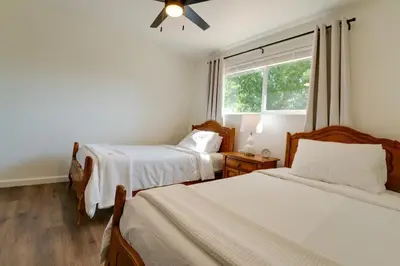 a bedroom with two beds and a window at Quiet Home with Yard 2 Mi to Mall and Sparks Marina! in Sparks