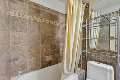 a bathroom with a shower and a toilet at Comfort in the Sierras - Edelweiss 2BR - Kirkwood condo in Markleeville
