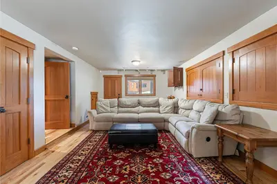 a living room with a couch and a table at Twin Hollow at Dollar Point by Tahoe Getaways - 5BR w Game Room & Hot Tub in Tahoe City