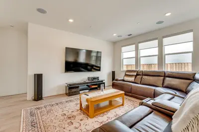 a living room with a couch and a tv at Newly Built Home with Patio 4 Mi to Dtwn Hollister in Hollister