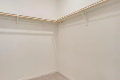 an empty closet with white walls and a pipe at Newly Built Home with Patio 4 Mi to Dtwn Hollister in Hollister
