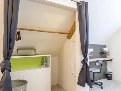 an attic room with a desk and a chair at Studio Loft Near Yosemite with Kitchenette in Oakhurst