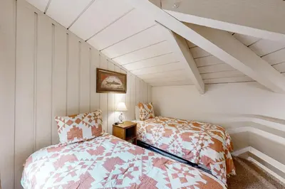 a bedroom with two beds in a attic at Sierra Park Villas 84 R in Mammoth Lakes