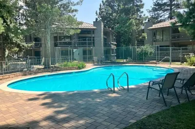 a swimming pool in front of a building at Sierra Park Villas 84 R in Mammoth Lakes