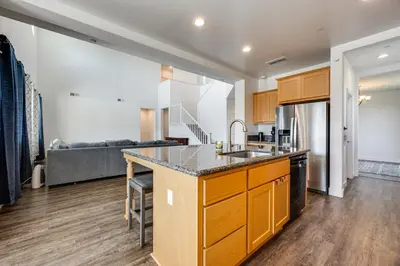 a kitchen with a sink and a counter top at 1 Mi to Golf! Spacious and Modern Home in Dinuba in Dinuba