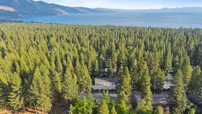 an aerial view of a house in the middle of a forest at Cozy Forest Hideaway in Incline Village Private Balcony Sierra Solace by AvantStay in Incline Village