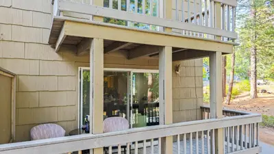 a porch of a house with purple chairs on it at Cozy Forest Hideaway in Incline Village Private Balcony Sierra Solace by AvantStay in Incline Village