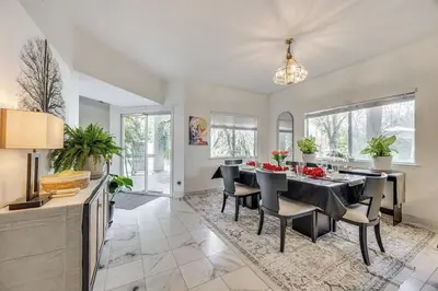 a dining room with a table and chairs at Rudraksha-5BR Luxury,3Bath, NE Fresno, Shopping, Dining, Medical, Tourist Attractions in Fresno
