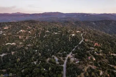 an aerial view of a road in the middle of a forest at 7BR 3Bath in Yosemite & Bass Lake with BBQ & Hot Tub in Oakhurst