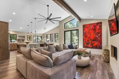 a large living room with a large couch at Song of the Sierras - 4 Bed, 4 Bath Luxury Tahoe Home in South Lake Tahoe
