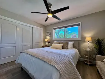 a bedroom with a bed with a ceiling fan at Peaceful Country Getaway Near Casino Shopping in Placerville