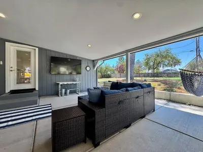 a living room with a couch and a large window at Peaceful Country Getaway Near Casino Shopping in Placerville