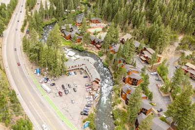 an aerial view of a resort with a river at River Run # 15 by Tahoe Getaways - 2 BR w Private Balcony, River Views & Shuttle in Alpine Meadows