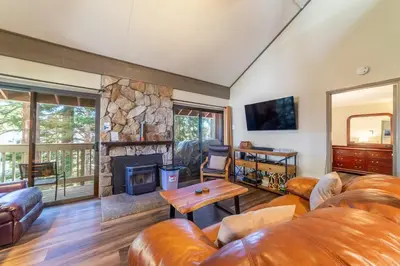 a living room with a couch and a fireplace at Walk to Village, 1+L/2BA; Jacuzzi, Parking, W/D in Mammoth Lakes