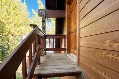 a wooden stairway leading up to a house at Hearthlight Cabin at Tahoe Donner by Tahoe Getaways - Pet-Friendly 3BR w Guest Suite in Truckee