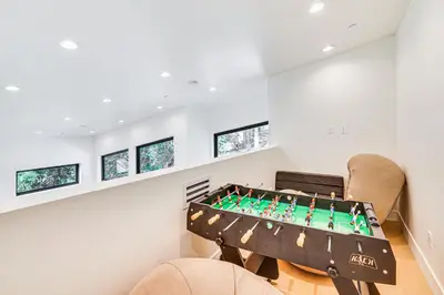 a living room with a foosball table at 4 Mi to Soda Springs Resort Hot Tub Hideaway! in Soda Springs
