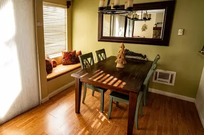 a dining room with a wooden table and chairs at Amazing Gem Next to golf course with View- Pool & jacuzzi in Mammoth Lakes