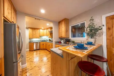 a kitchen with wooden cabinets and a wooden counter top at Historic Mountain Retreat - Near Boreal - 3 Kings in Emigrant Gap