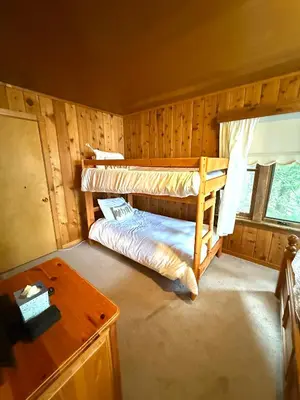 a bedroom with two bunk beds in a cabin at Lake Tahoe Cabin I Hammocks, Paddle Boards and Bikes in Homewood