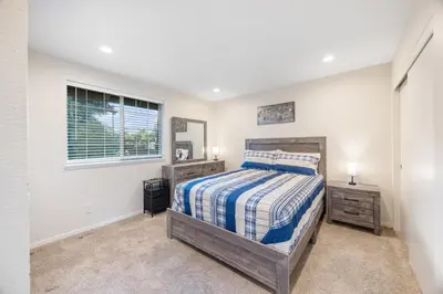 a bedroom with a bed and a window at Cozy Nest Across the street from UC Davis Sacramento in Sacramento