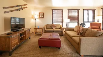 a living room with a couch and a tv at Kingsbury of Tahoe in Stateline