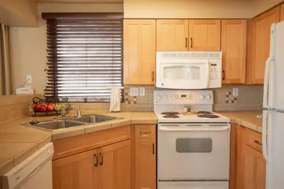a kitchen with a white stove and a sink at Kingsbury of Tahoe in Stateline