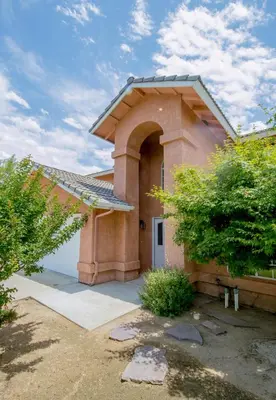 a brick house with an arched entry way at Cozy Room#1 Best Moscato in Clovis