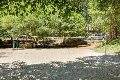 a volleyball net in the middle of a park at Community Lake Access Peaceful Cabin in Sonora! in Sonora