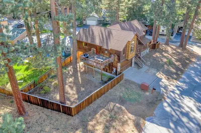 an overhead view of a log cabin in the woods at Tahoe Island Retreat Hot Tub & Game Room in South Lake Tahoe