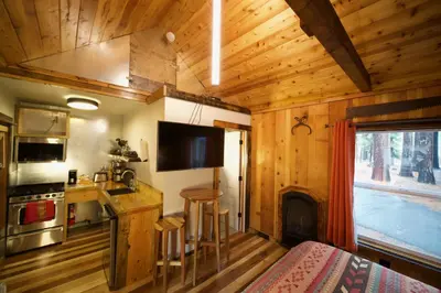 a kitchen with a stove and a counter top in a cabin at Tamarack Lodge Motel in Tahoe City