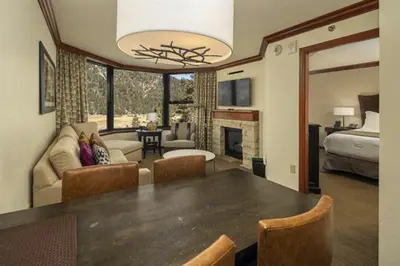 a living room with a dining table and a bedroom at Community Perks! Everline Resort and Spa Retreat in Olympic Valley