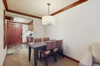 a dining room with a table and chairs at Community Perks! Everline Resort and Spa Retreat in Olympic Valley