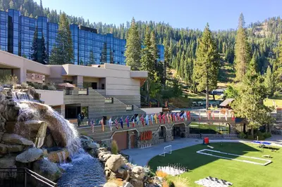 a resort with a waterfall and a water park at Community Perks! Everline Resort and Spa Retreat in Olympic Valley