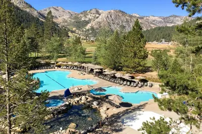 an aerial view of a resort with mountains in the background at Community Perks! Everline Resort and Spa Retreat in Olympic Valley