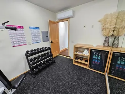 a room with a gym with a bunch of equipment at Cedar Rock Cabin in Mi-Wuk Village