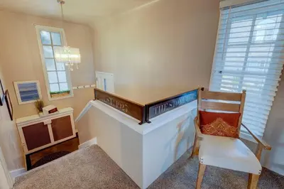 a room with a staircase with a chair and a desk at Historic Stone House-Reno-UNR-Family in Reno