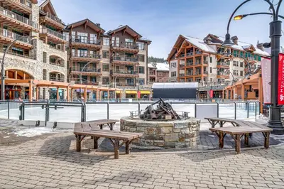 two benches and a fire hydrant in a city at Northstar Ski-InandOut Condo with Resort Amenities! in Truckee
