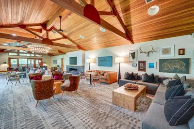 a large living room with couches and tables at Northstar Ski-InandOut Condo with Resort Amenities! in Truckee