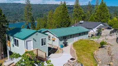 an aerial view of a house with a green roof at Lake View Suite for 2-Hot Tub-Dog Friendly in Bass Lake Annex