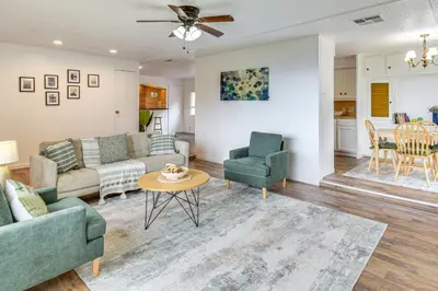 a living room with a couch and chairs and a table at Mtn-View Coulter Escape with Rustic Tree Lookout in Coulterville