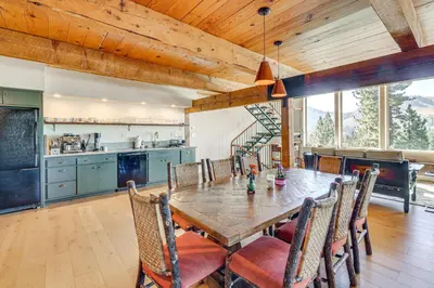 a kitchen and dining room with a table and chairs at Endless Mtn Views! Group Ski Lodge at Sugar Bowl in Norden