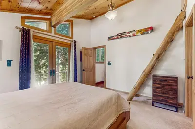 a bedroom with a large bed in a room at Tahoe Timber Retreat in Carnelian Bay