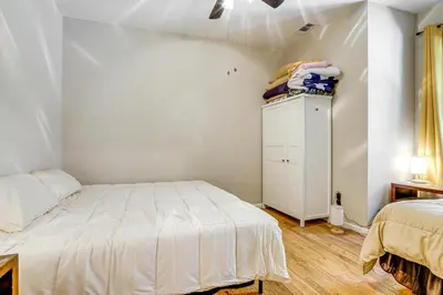 a bedroom with a bed and a dresser in a room at All-Season Outdoor Base Camp Gold Country Home! in Fiddletown