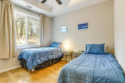 a bedroom with two beds and a window at All-Season Outdoor Base Camp Gold Country Home! in Fiddletown