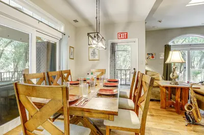 a dining room with a wooden table and chairs at All-Season Outdoor Base Camp Gold Country Home! in Fiddletown