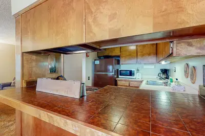 a large kitchen with a large wooden counter top at Fireside 111 in Mammoth Lakes