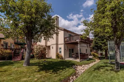 an exterior view of a house with trees at Moler Lake House in Bass Lake
